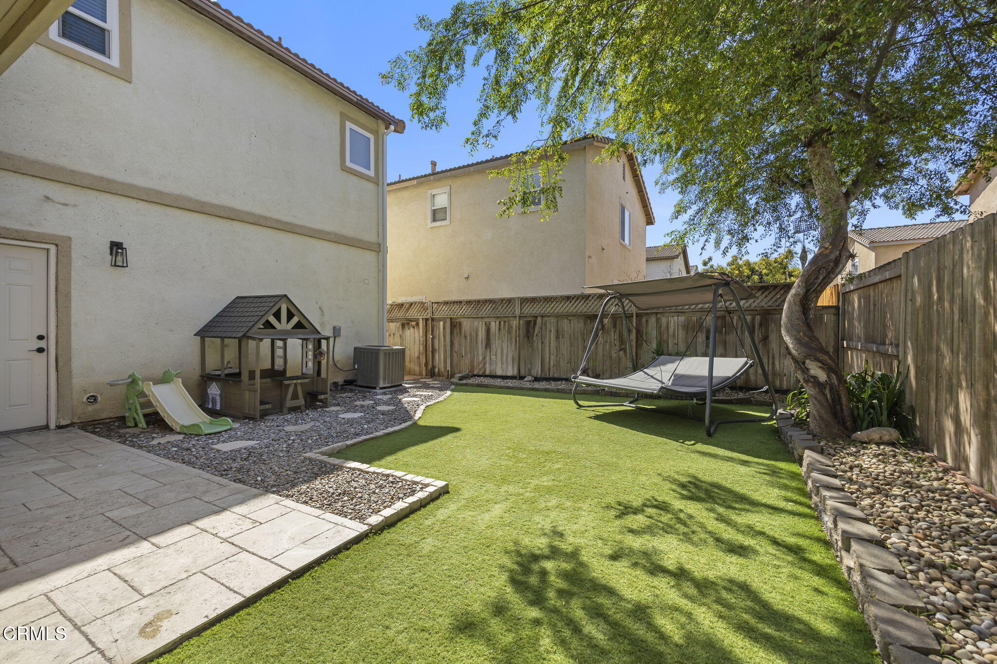 803 Noontide Way Oxnard, CA 93035 - Photo 20 of 44 a view of a backyard with furniture and a slide