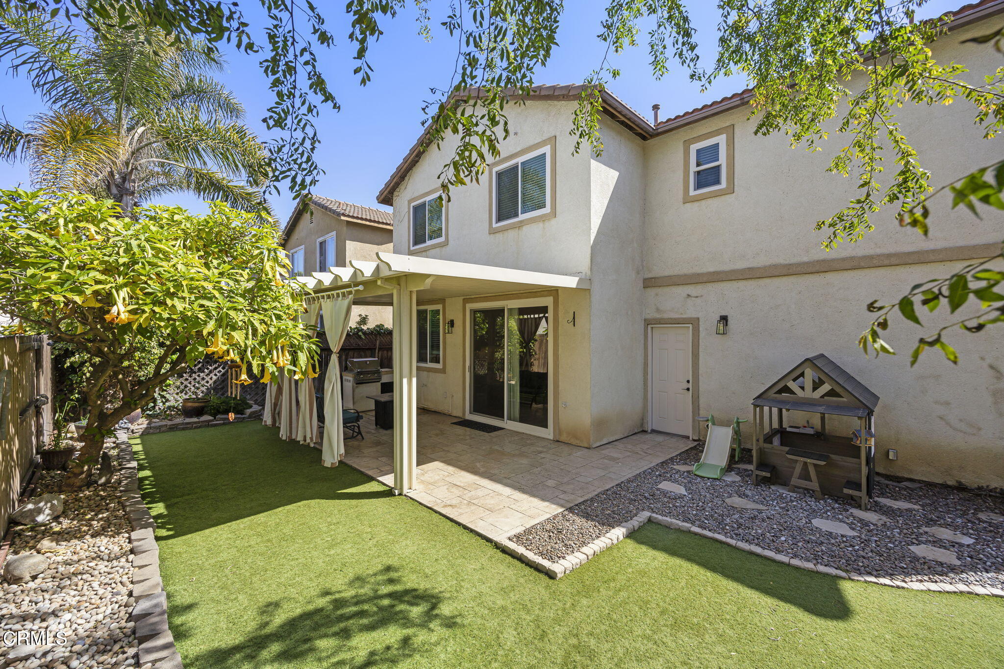 803 Noontide Way Oxnard, CA 93035 - Photo 21 of 44 a front view of a house with garden