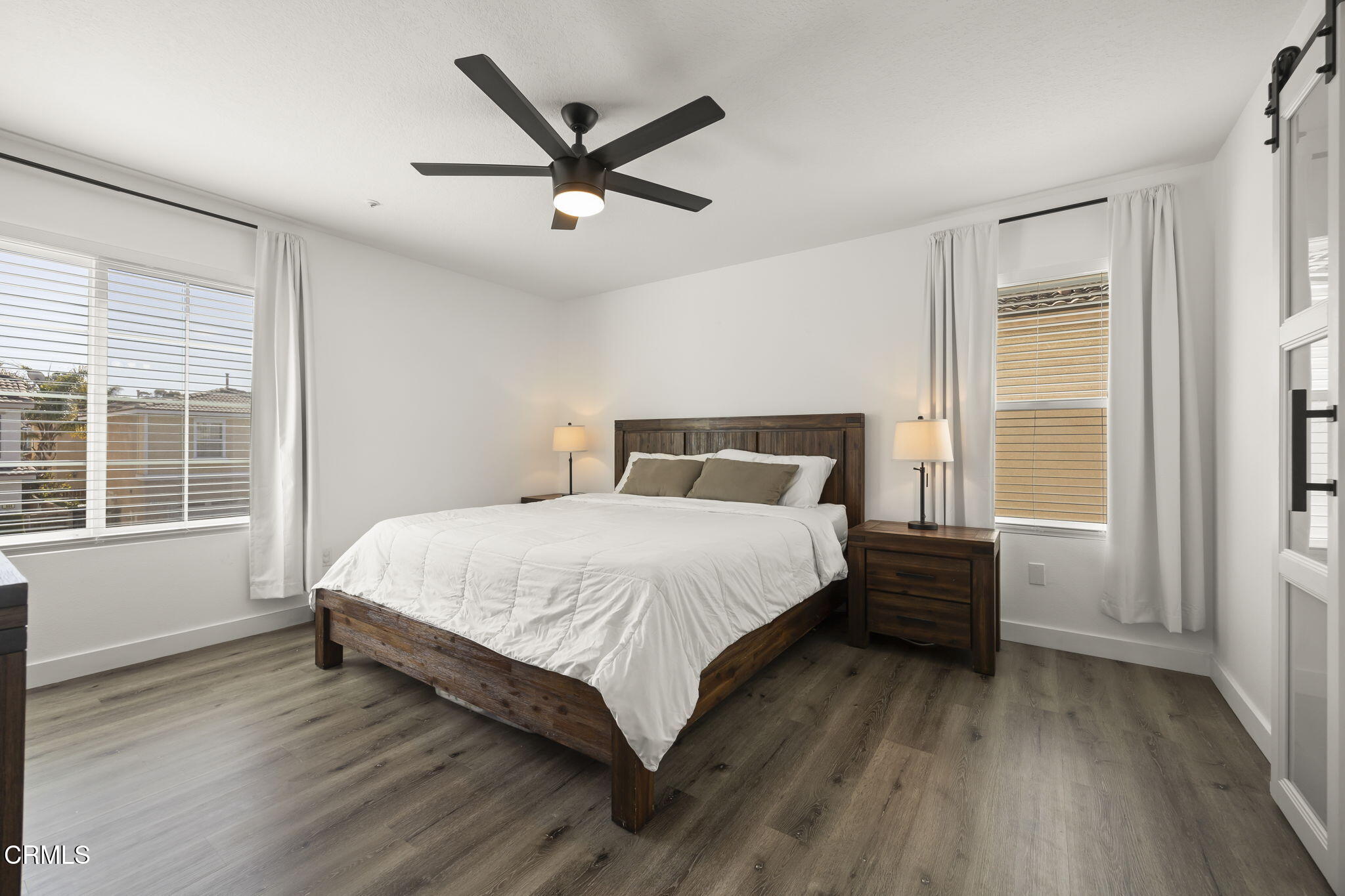 803 Noontide Way Oxnard, CA 93035 - Photo 23 of 44 a bedroom with a large bed and a window