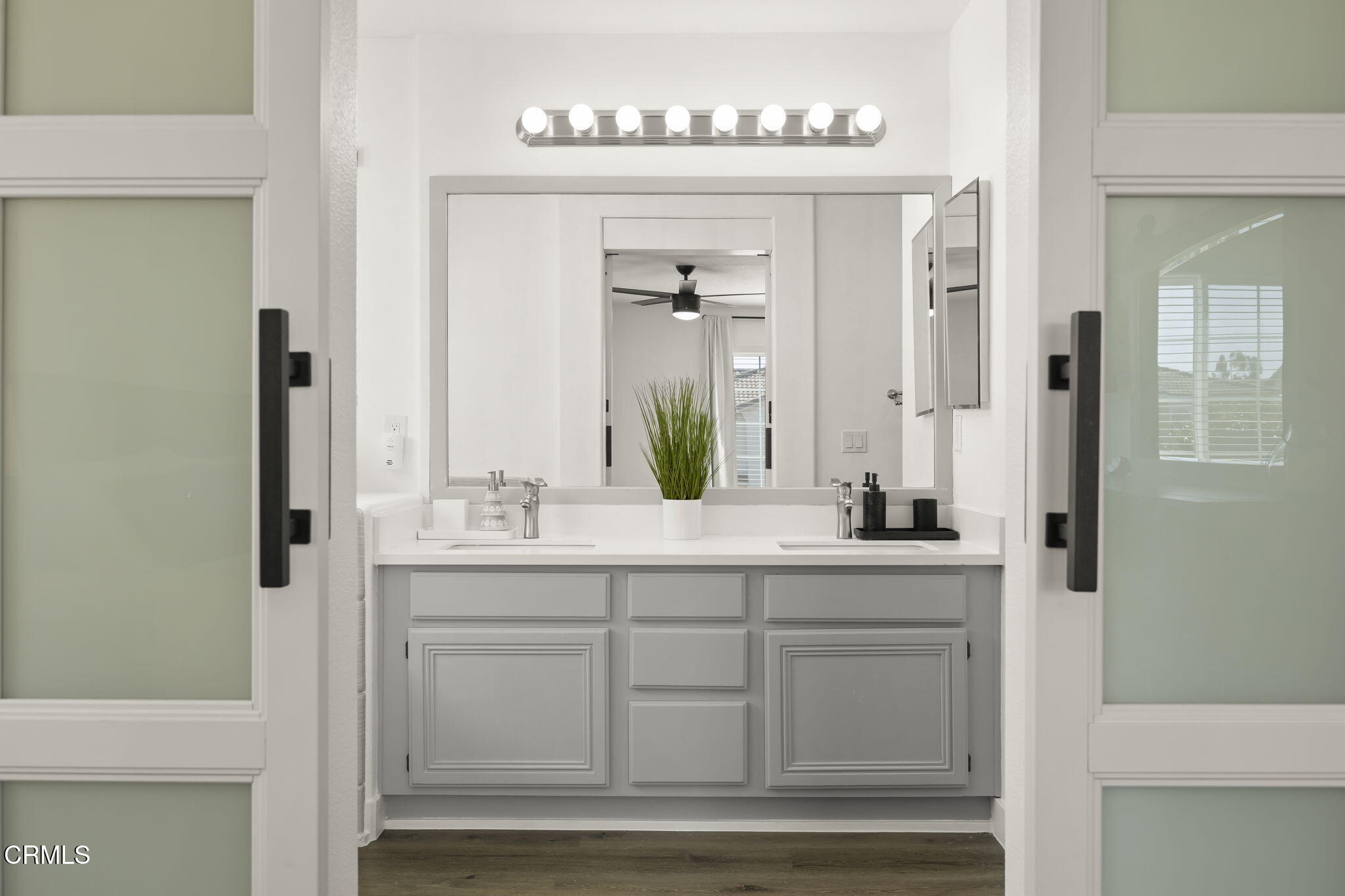 803 Noontide Way Oxnard, CA 93035 - Photo 25 of 44 a bathroom with a sink and a mirror