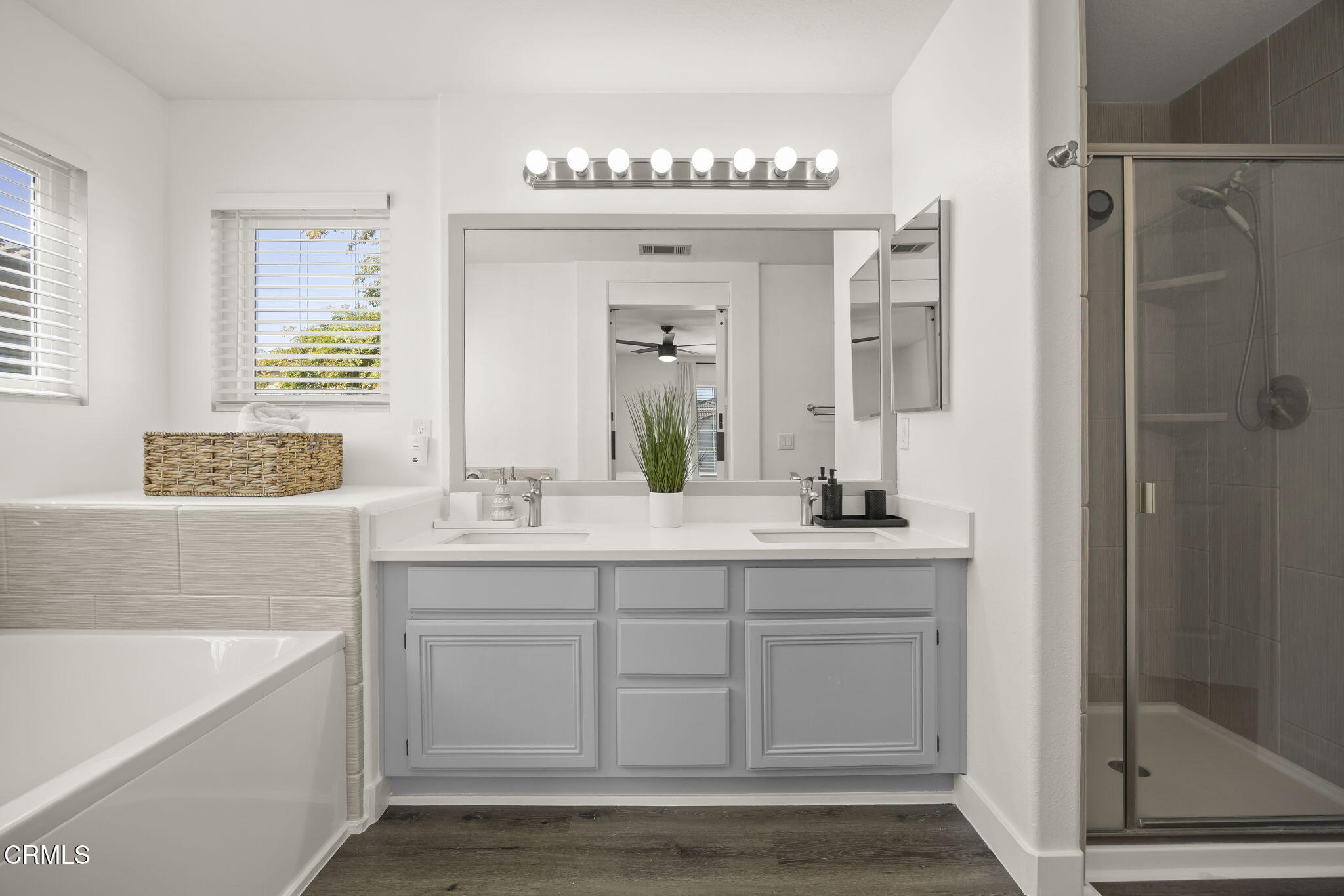 803 Noontide Way Oxnard, CA 93035 - Photo 26 of 44 a bathroom with a granite countertop sink mirror and bathtub