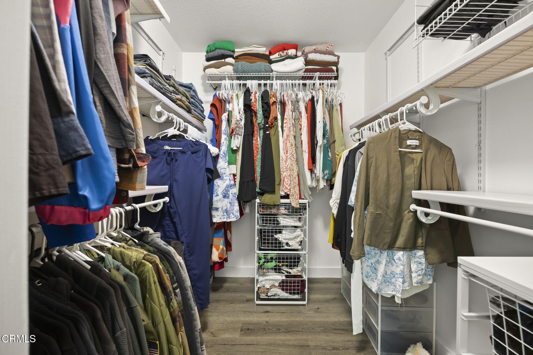 803 Noontide Way Oxnard, CA 93035 - Photo 28 of 44 a view of walk in closet with clothes and shoes