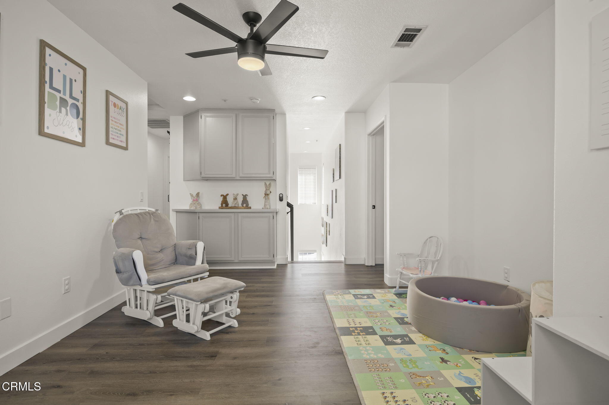 803 Noontide Way Oxnard, CA 93035 - Photo 30 of 44 a living room with furniture and a wooden floor