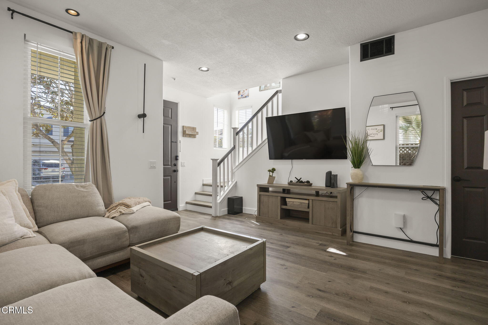 803 Noontide Way Oxnard, CA 93035 - Photo 5 of 44 a living room with furniture and a flat screen tv