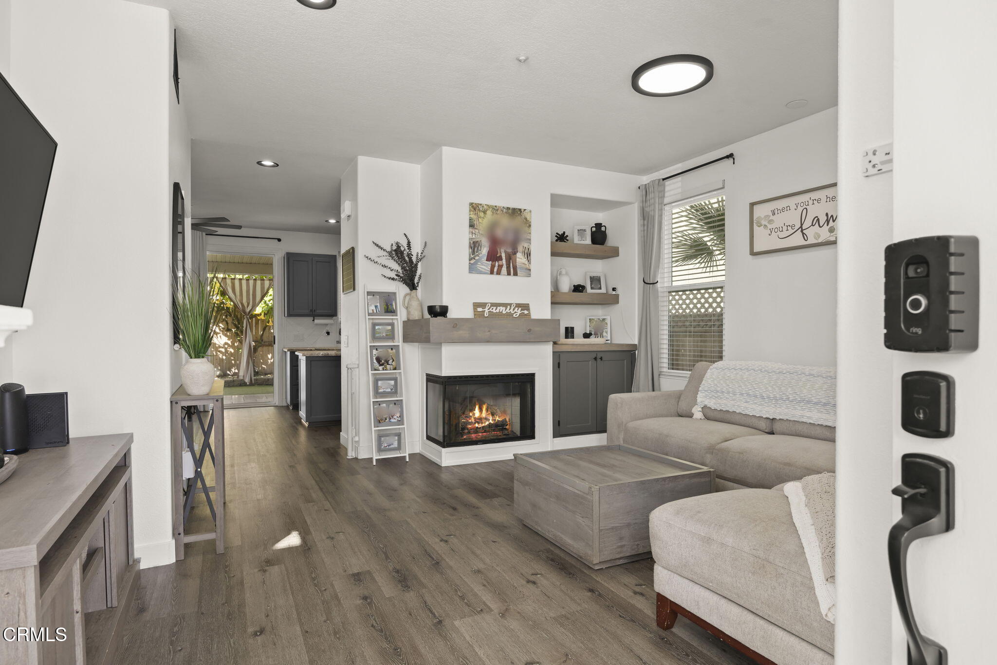 803 Noontide Way Oxnard, CA 93035 - Photo 8 of 44 a living room with furniture and a fireplace