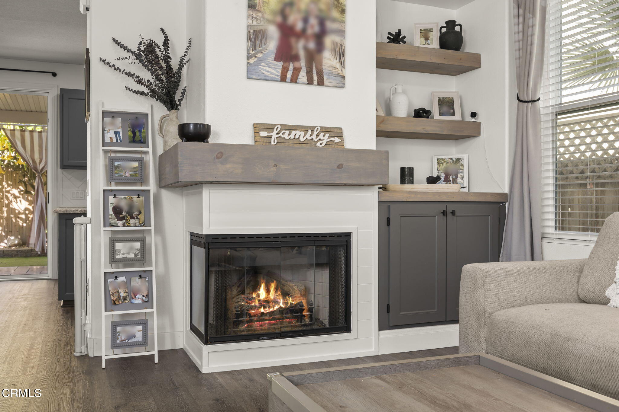 803 Noontide Way Oxnard, CA 93035 - Photo 9 of 44 a living room with furniture and a fireplace