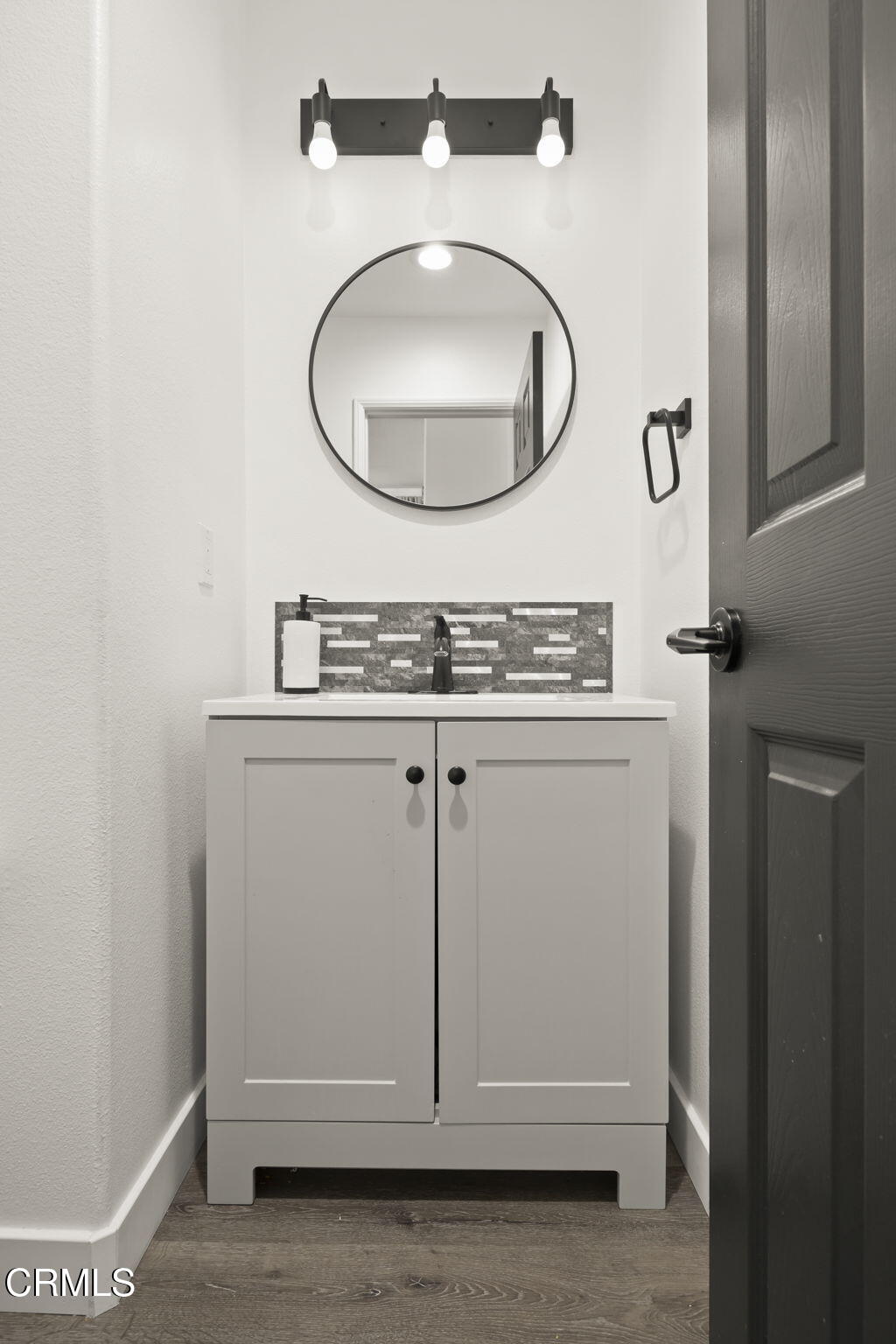 803 Noontide Way Oxnard, CA 93035 - Photo 10 of 44 a bathroom with a sink and a mirror