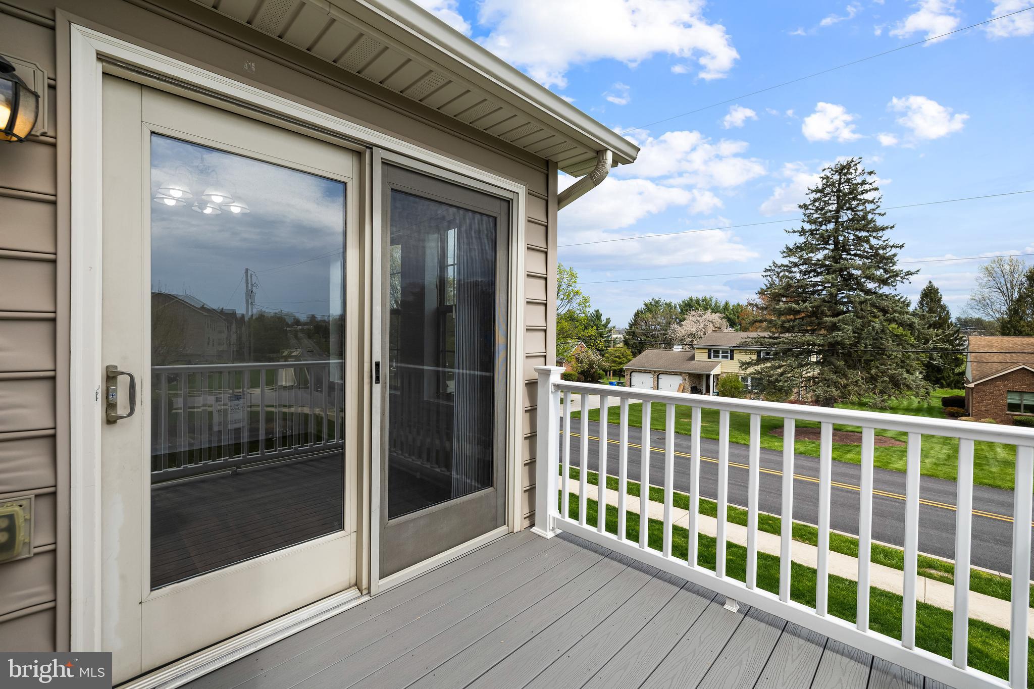 34 Shady Tree Court York, PA 17402 - Photo 12 of 22 a view of a balcony with floor to ceiling window wooden floor and fence
