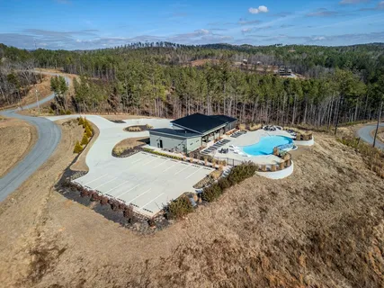 a view of a swimming pool with a yard