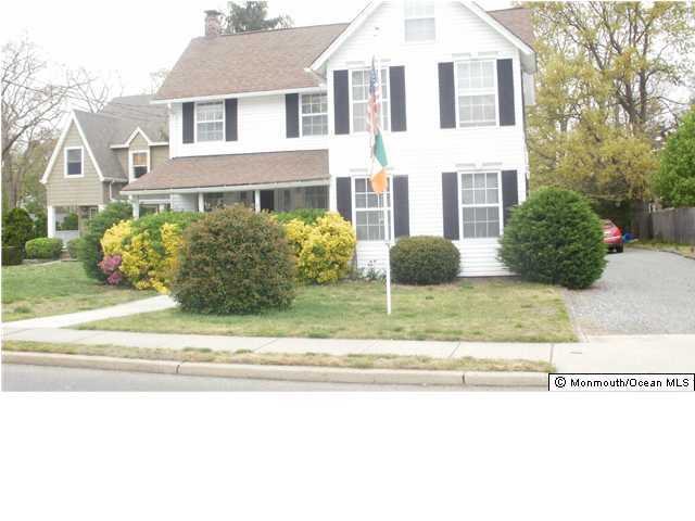 800 Wall Road Spring Lake Heights, NJ 07762 - Photo 1 of 6 a front view of a house with a garden