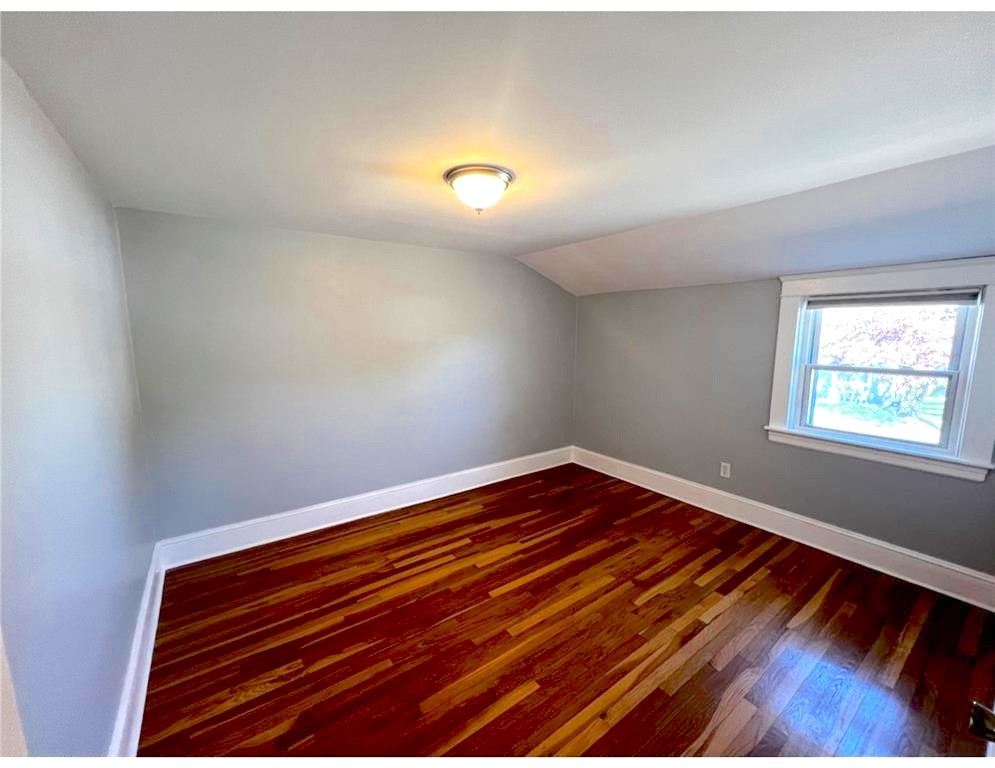 348 Market Street Warren, RI 02885 - Photo 16 of 22 Overlooking the rear yard is den or office area for working from home.