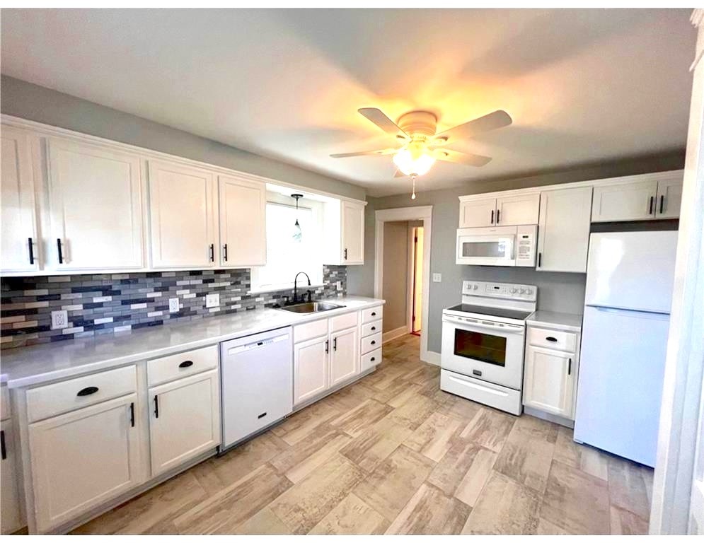 348 Market Street Warren, RI 02885 - Photo 3 of 22 Nicely updated kitchen with tile backsplash & new appliances.