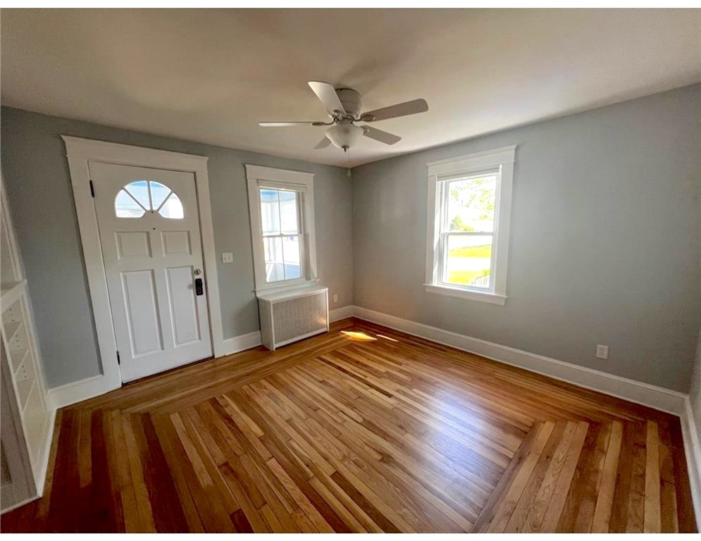 348 Market Street Warren, RI 02885 - Photo 5 of 22 Sun filled rooms with. beautiful wood flooring.