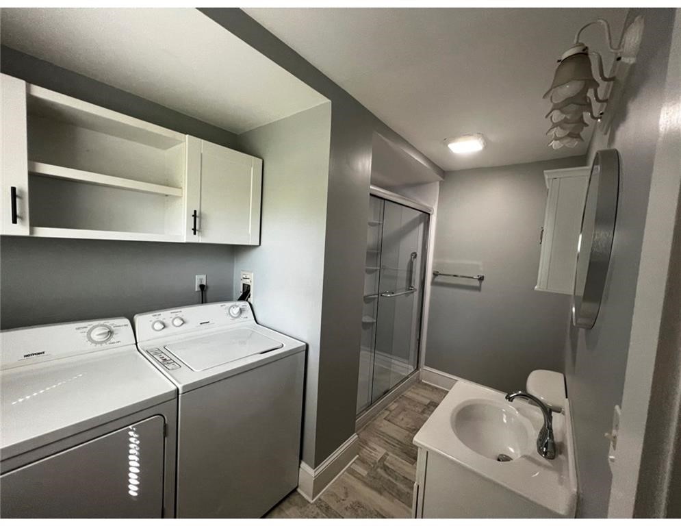 348 Market Street Warren, RI 02885 - Photo 8 of 22 Main bath with laundry and additional storage space.