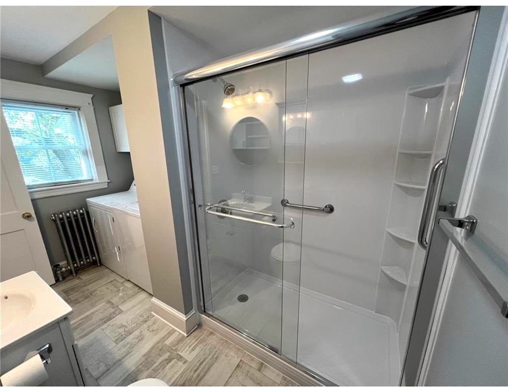 348 Market Street Warren, RI 02885 - Photo 9 of 22 Renovated first floor bath room with a large walk-in shower stall