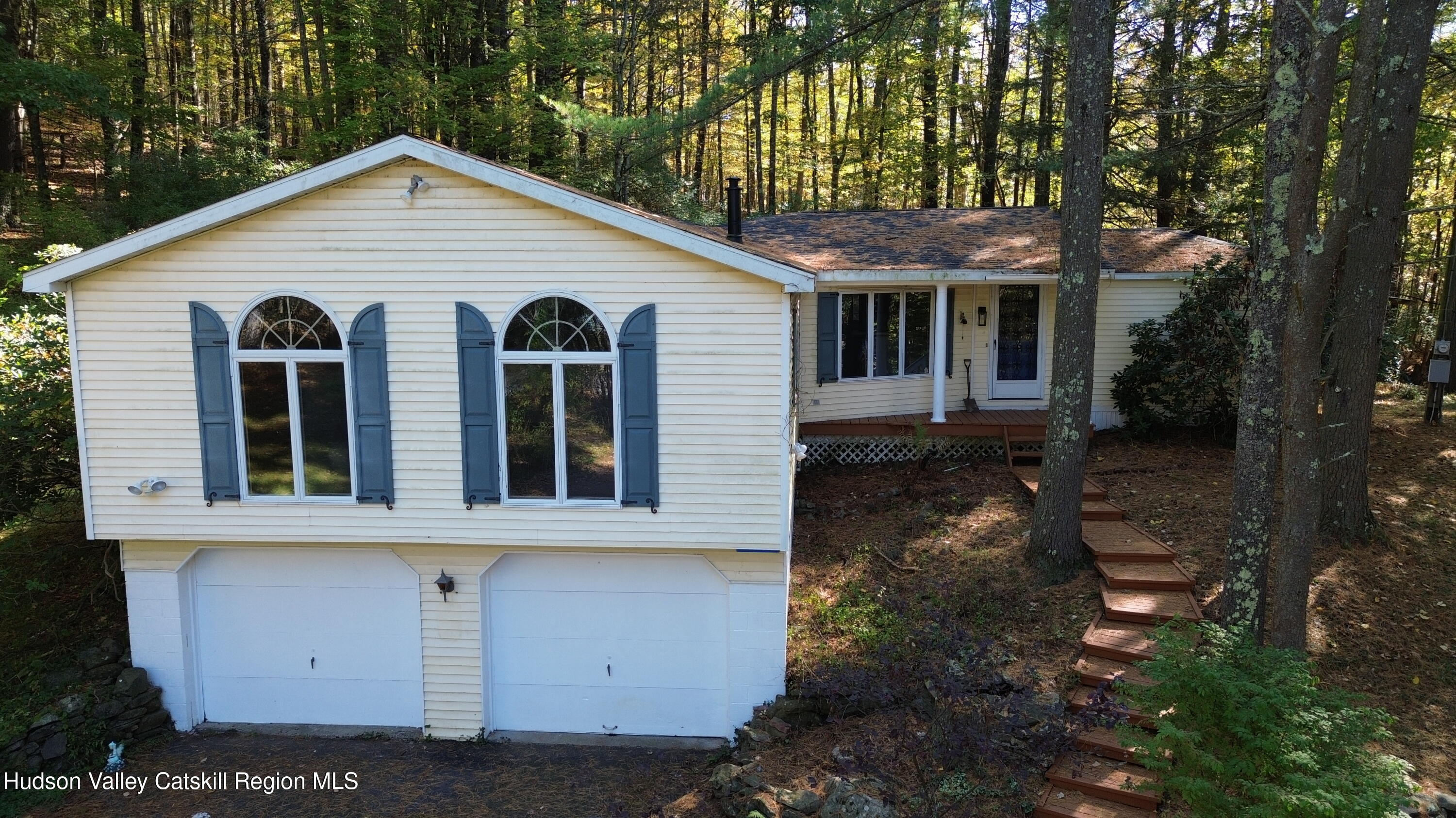 front view of a house with a yard