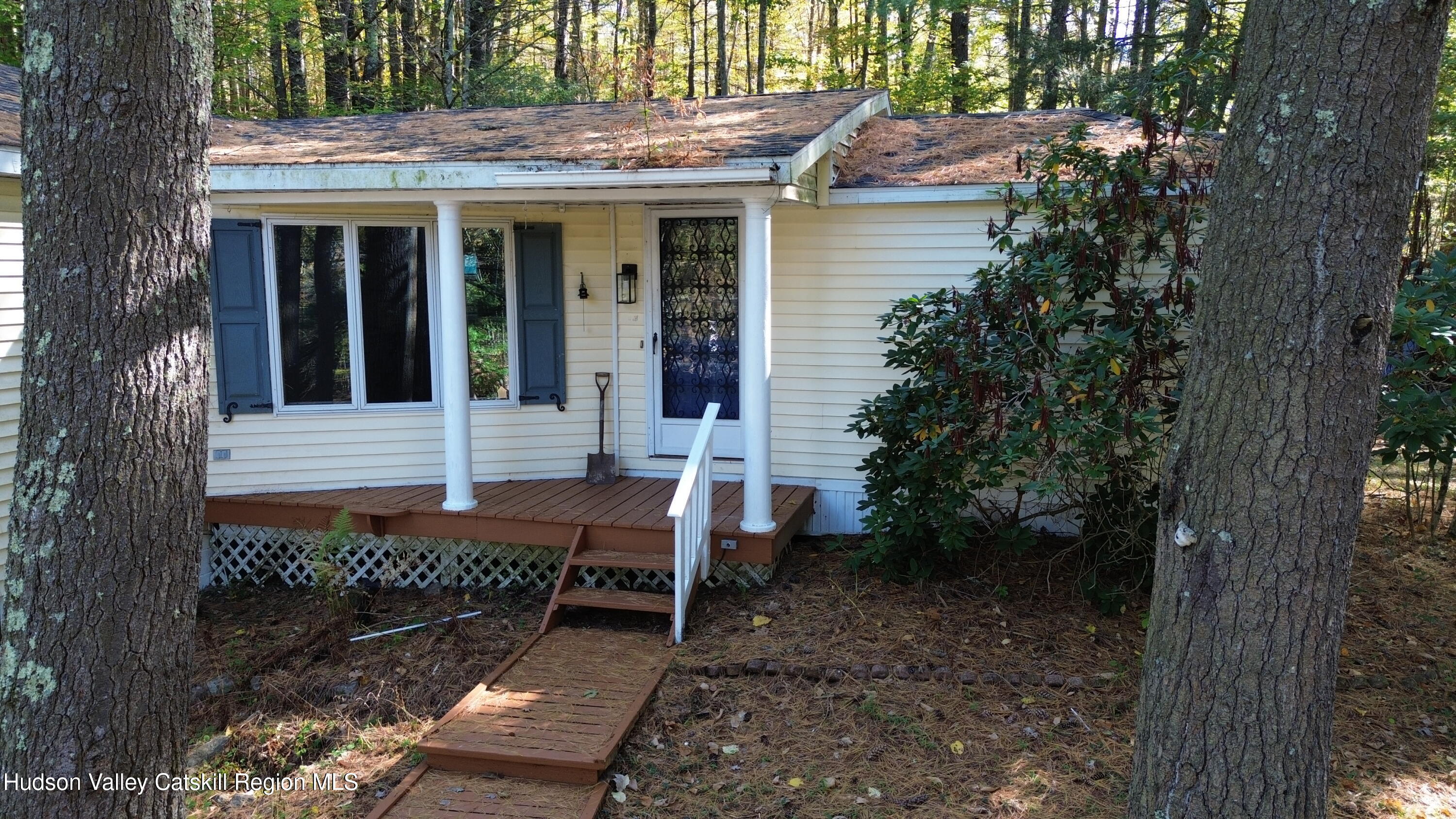 1072 Honey Hollow Road Earlton, NY 12058 - Photo 3 of 15 a view of a house with a small yard and deck