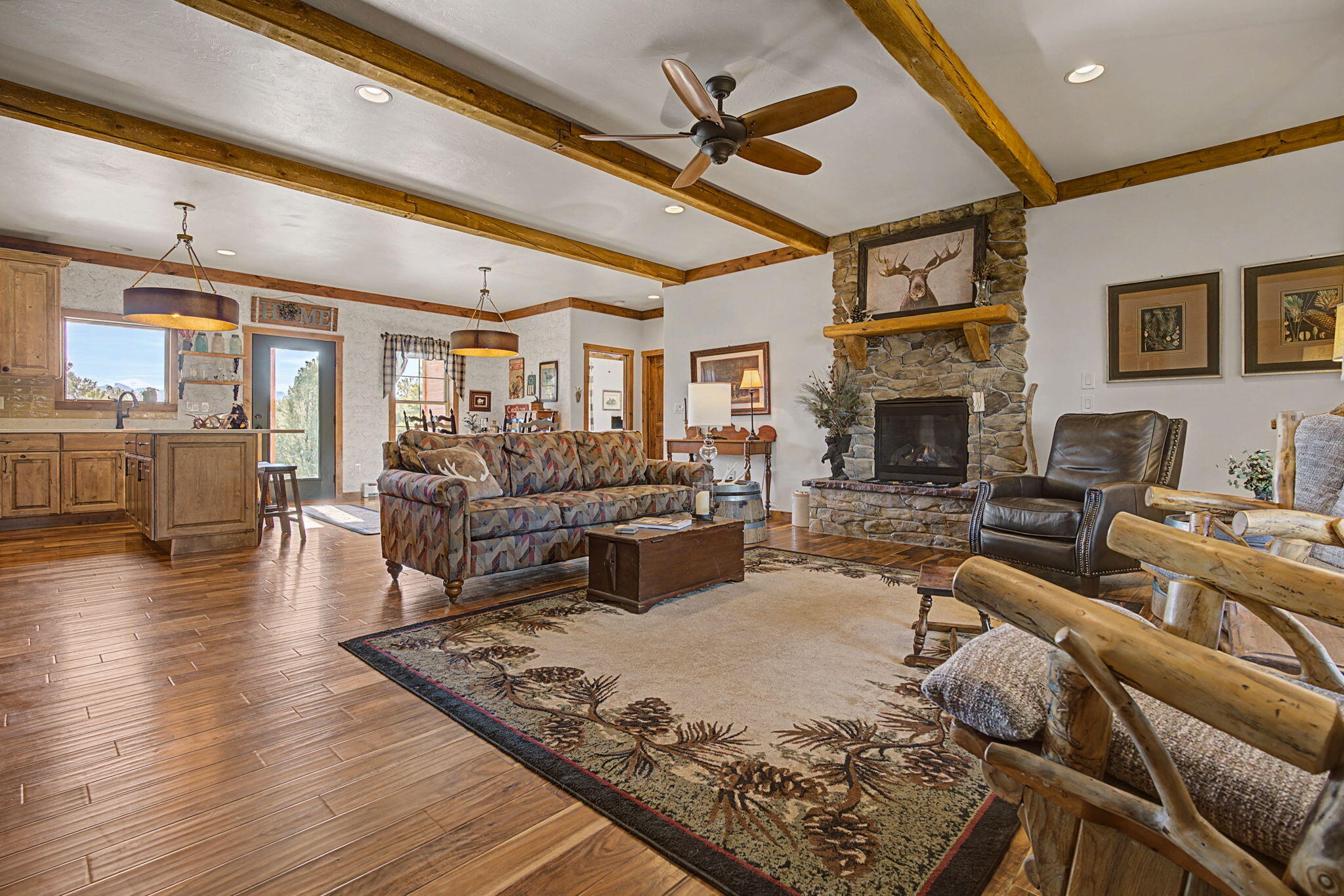 213 Big Canyon Point Ridgway, CO 81432 - Photo 3 of 41 a living room with furniture large window and a fireplace