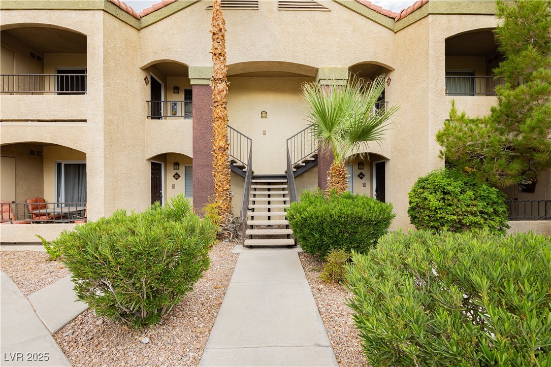 View of building exterior featuring stairway