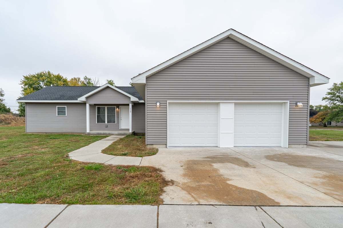 a front view of a house with a yard