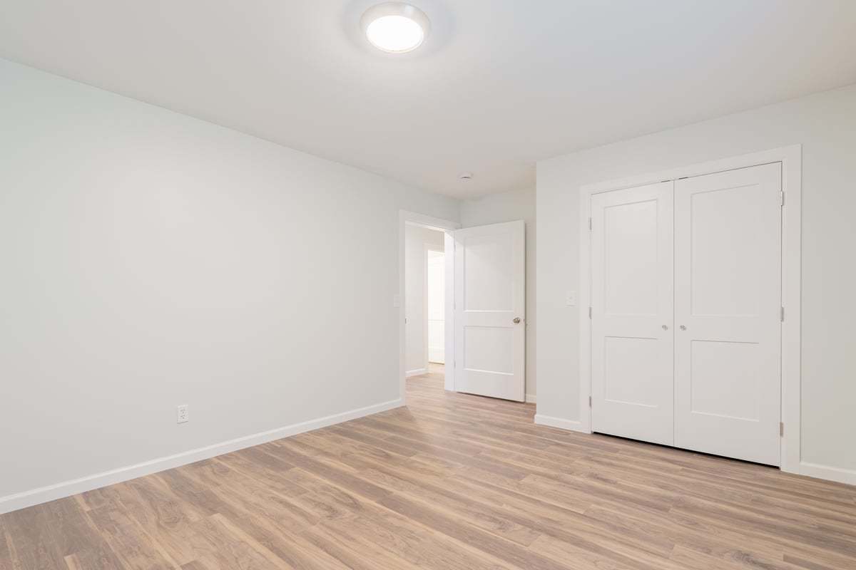 113 Prairie Run Illiopolis, IL 62539 - Photo 17 of 24 a view of an empty room and wooden floor
