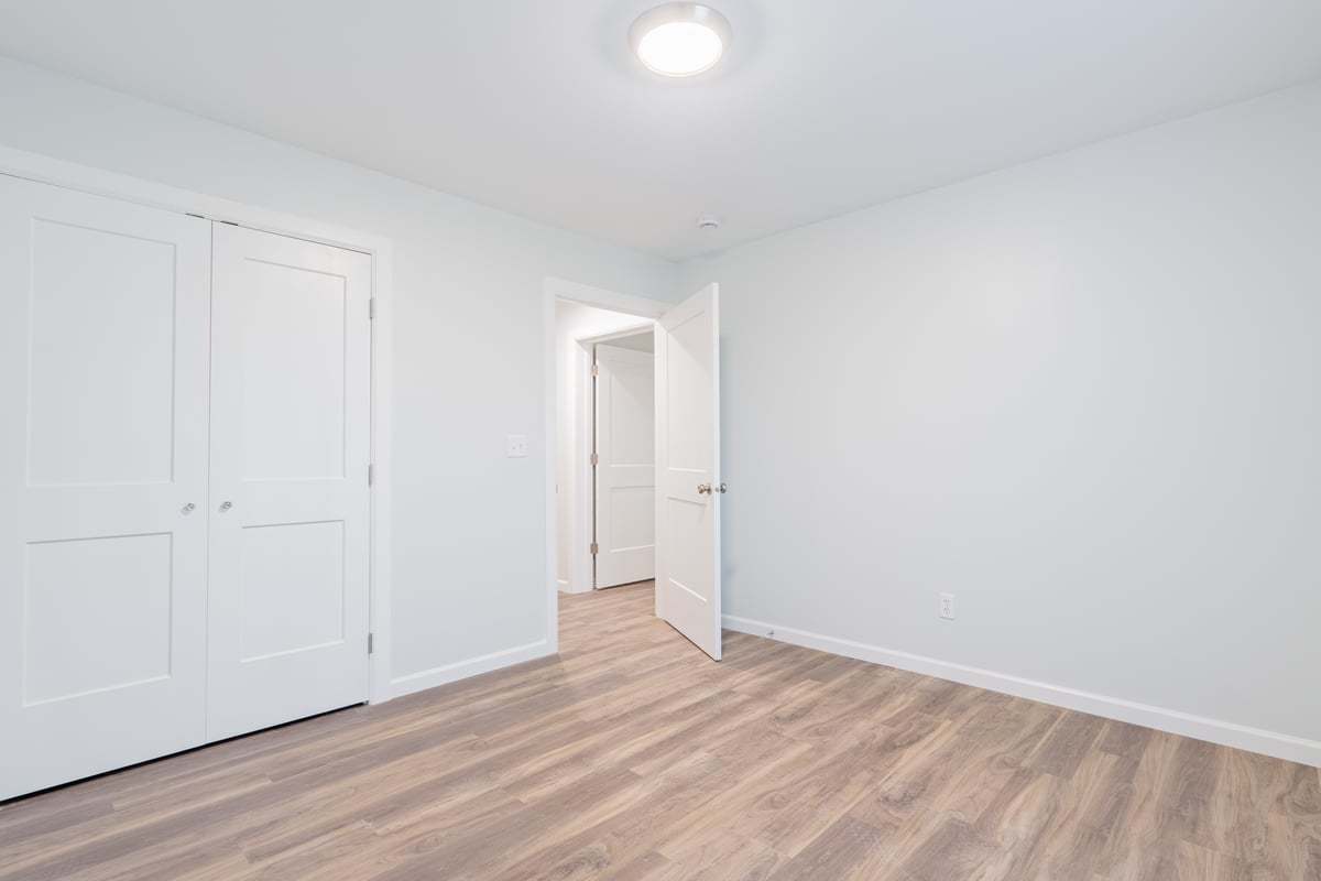 113 Prairie Run Illiopolis, IL 62539 - Photo 18 of 24 a view of an empty room and wooden floor