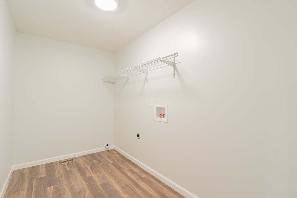 113 Prairie Run Illiopolis, IL 62539 - Photo 20 of 24 a view of a room with racks on the wall