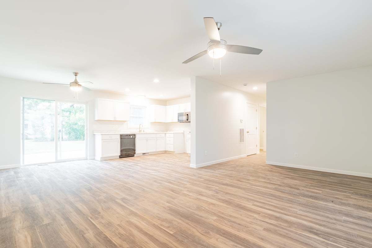 113 Prairie Run Illiopolis, IL 62539 - Photo 5 of 24 an empty room with wooden floor and windows