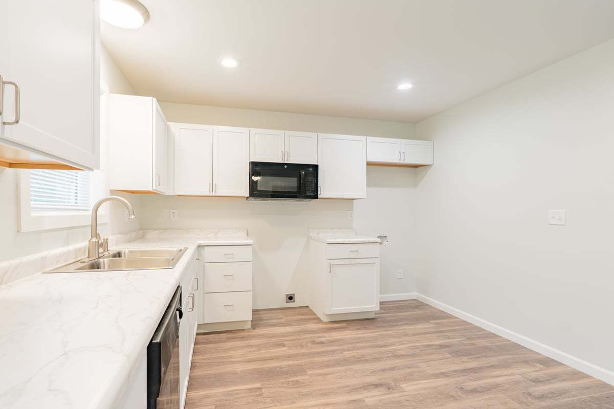 113 Prairie Run Illiopolis, IL 62539 - Photo 7 of 24 a kitchen with stainless steel appliances a sink stove and cabinets