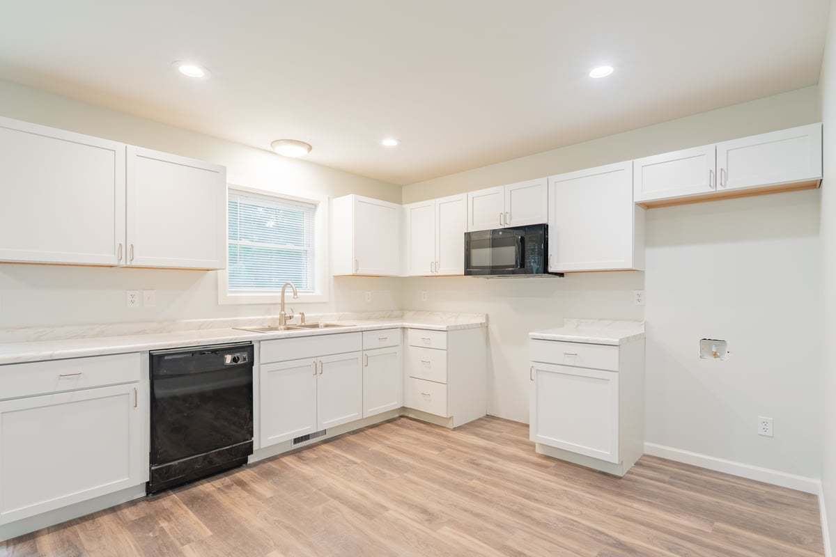 113 Prairie Run Illiopolis, IL 62539 - Photo 8 of 24 a kitchen with granite countertop white cabinets and white appliances