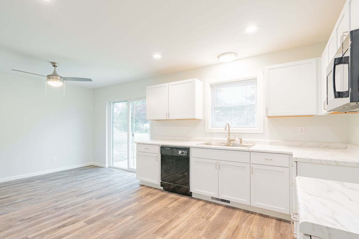 113 Prairie Run Illiopolis, IL 62539 - Photo 9 of 24 a kitchen with a sink cabinets and window