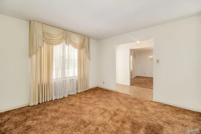 a view of an empty room and window