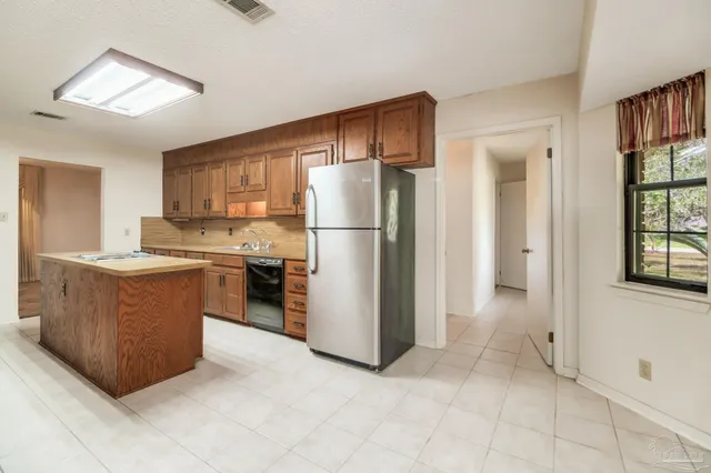 a kitchen with cabinets a sink and a stove