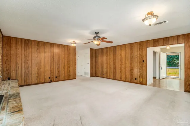 a spacious bathroom with a granite countertop sink a toilet and shower