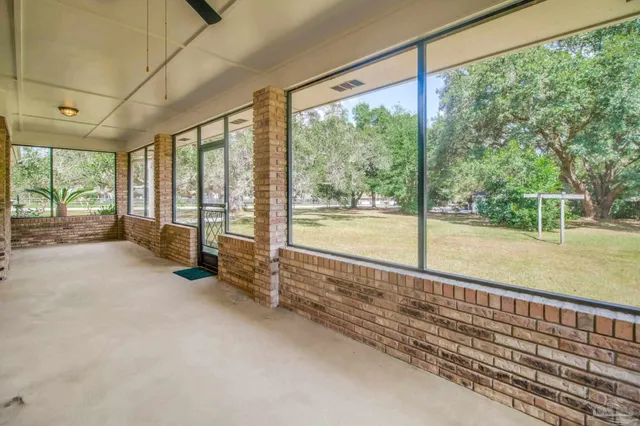 a view of a house with a yard and swimming pool