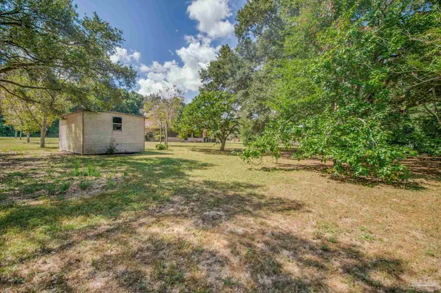 a view of a yard with an outdoor space