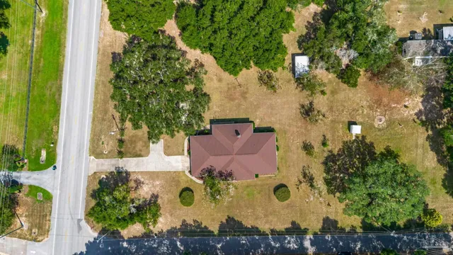 an aerial view of a house with a garden