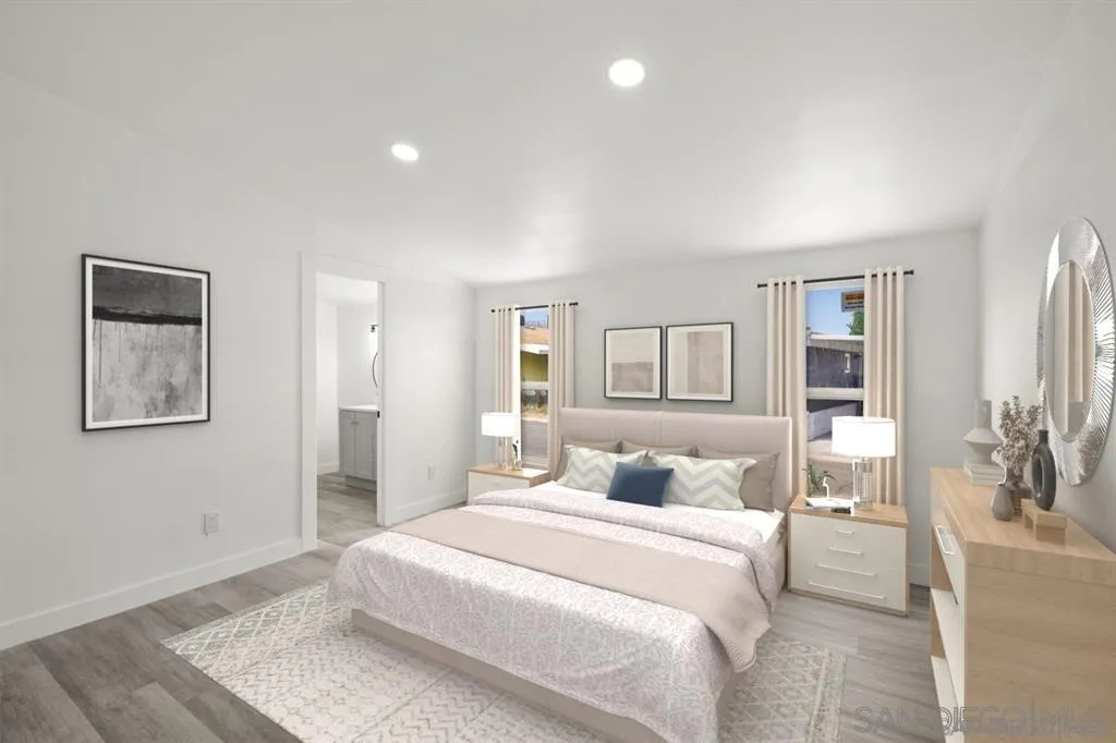 10767 Jamacha Boulevard, Unit SPC 62 Spring Valley, CA 91978 - Photo 11 of 25 a bedroom with a large bed and a painting on the wall
