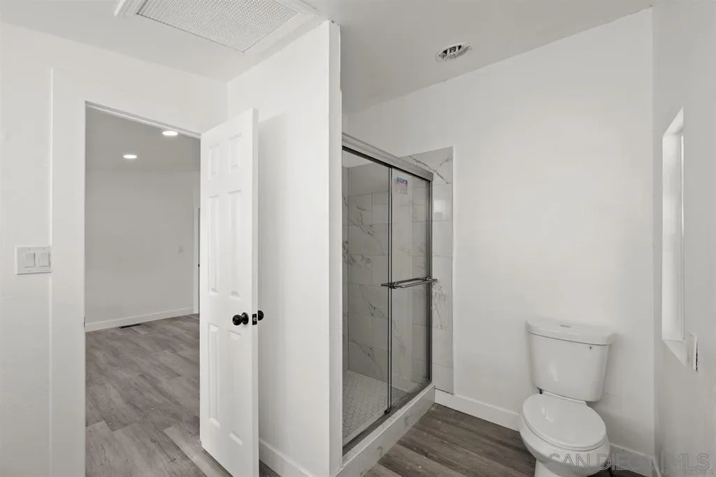 10767 Jamacha Boulevard, Unit SPC 62 Spring Valley, CA 91978 - Photo 15 of 25 a bathroom with a toilet and a shower