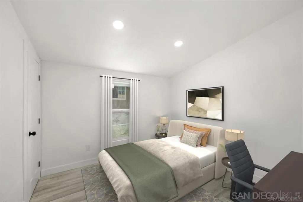 10767 Jamacha Boulevard, Unit SPC 62 Spring Valley, CA 91978 - Photo 20 of 25 a bedroom with a bed and painting on the wall