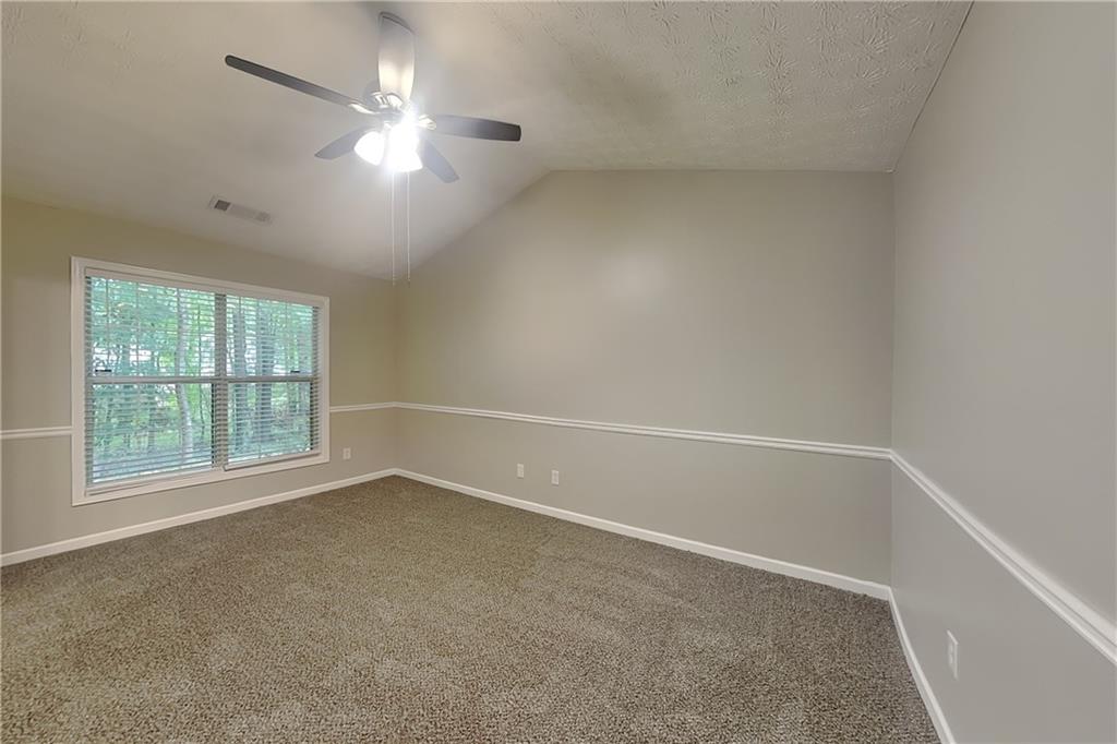 3318 Freedom Landing Northwest Kennesaw, GA 30144 - Photo 7 of 15 en empty room with windows and ceiling fan