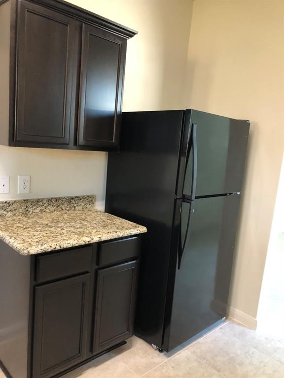 140 Curt Street Anna, TX 75409 - Photo 13 of 25 a bathroom with a granite countertop sink and a mirror