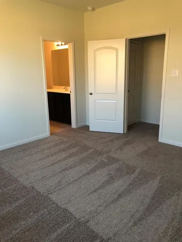 a bath room with a toilet and a bath tub