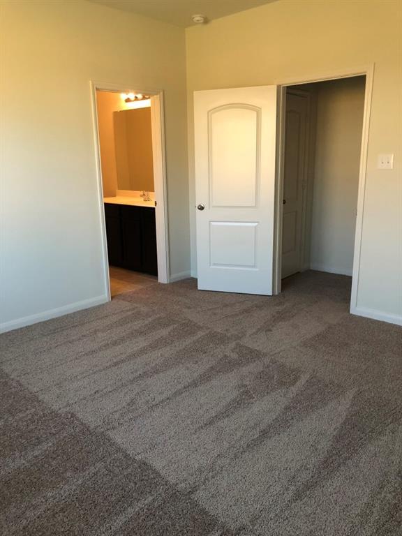 140 Curt Street Anna, TX 75409 - Photo 18 of 25 an empty room with closet and windows