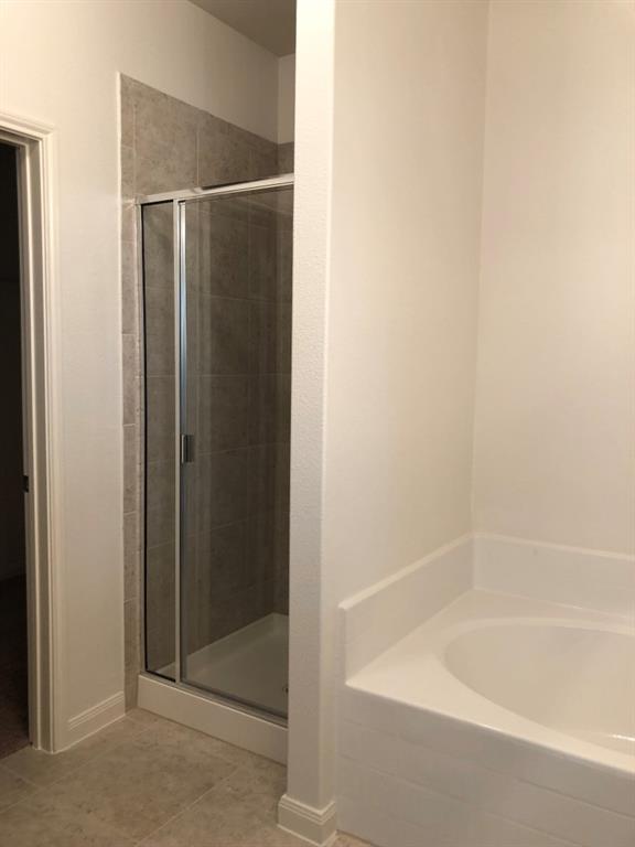 140 Curt Street Anna, TX 75409 - Photo 24 of 25 a bathroom with a bathtub