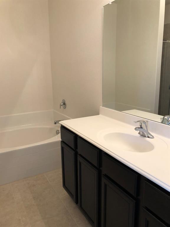 140 Curt Street Anna, TX 75409 - Photo 25 of 25 a bathroom with a sink and a bathtub