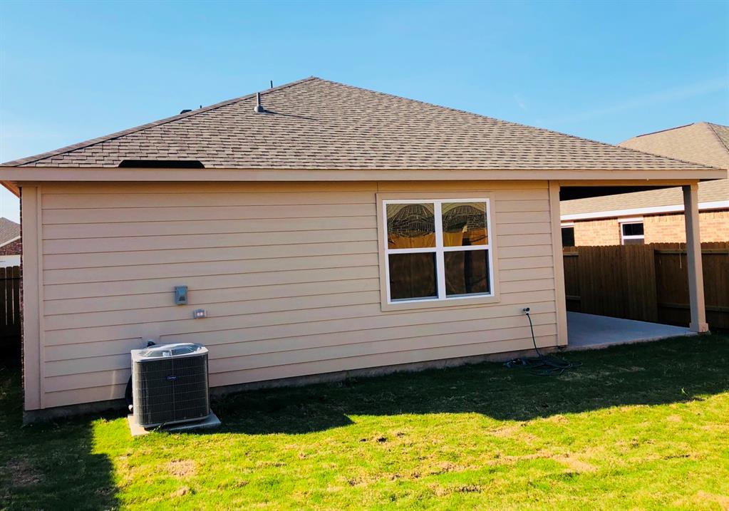 140 Curt Street Anna, TX 75409 - Photo 4 of 25 a front view of a house with a yard