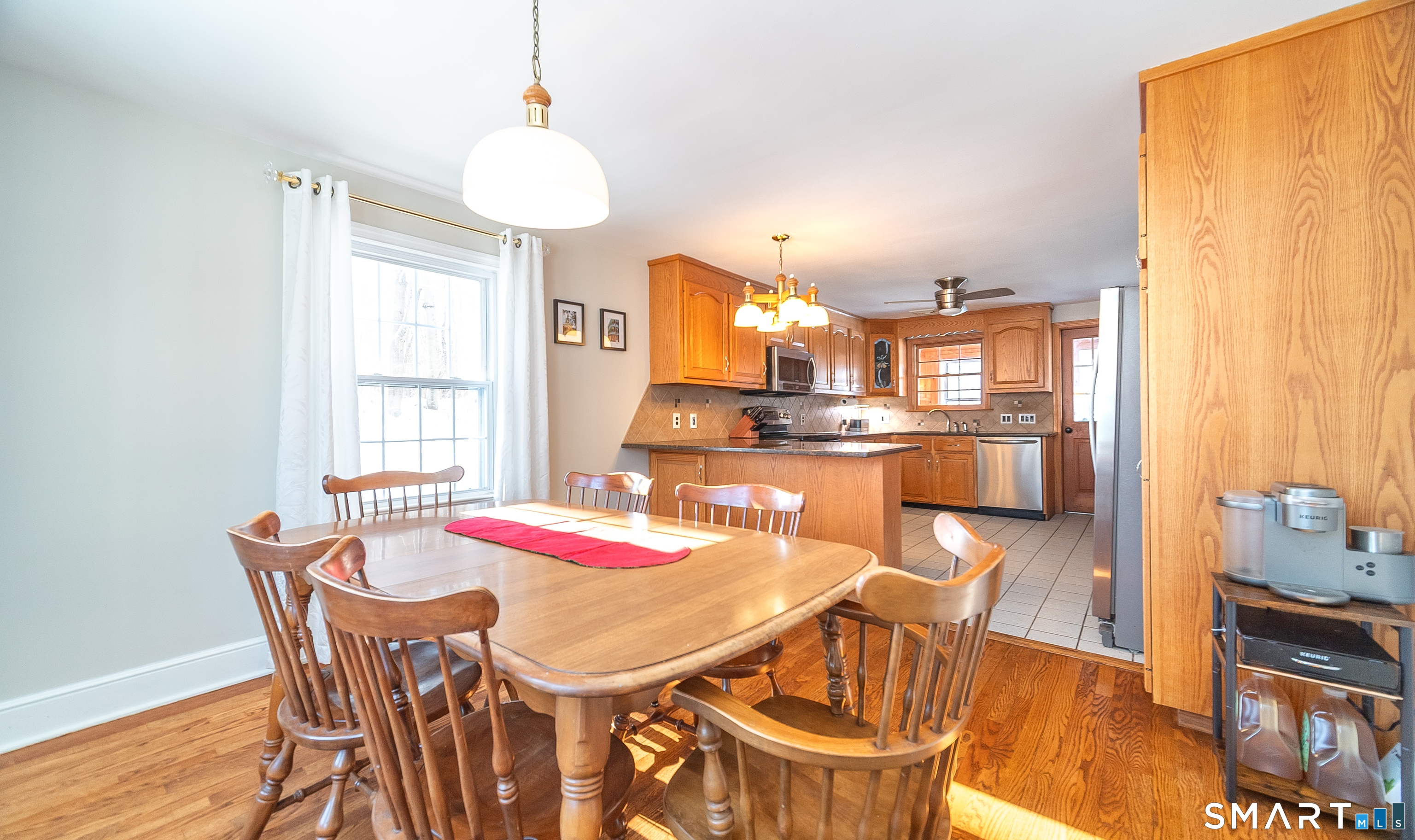 45 Craig Avenue Southington, CT 06489 - Photo 16 of 40 a view of a dining room with furniture and wooden floor