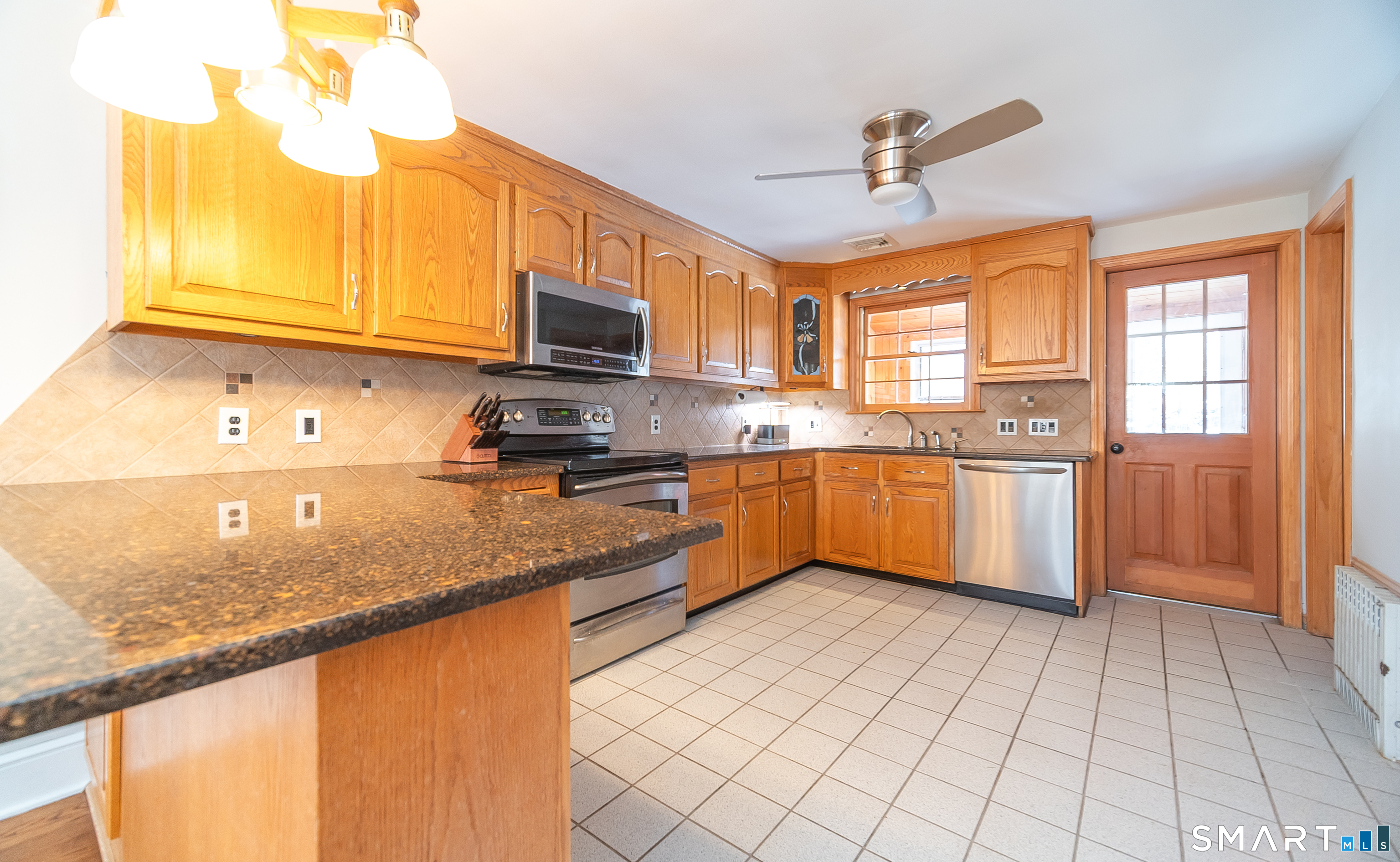 45 Craig Avenue Southington, CT 06489 - Photo 18 of 40 a kitchen with stainless steel appliances granite countertop a sink dishwasher stove top oven and cabinets