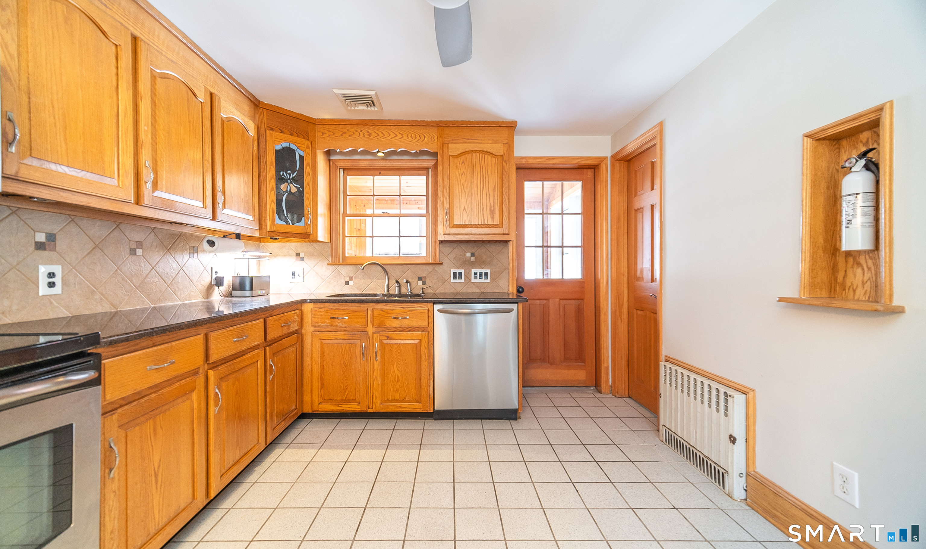 45 Craig Avenue Southington, CT 06489 - Photo 20 of 40 a kitchen with stainless steel appliances granite countertop a refrigerator and a sink